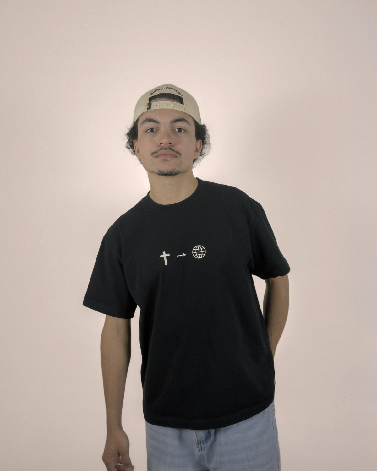 Tell The World Christian tee in black, front